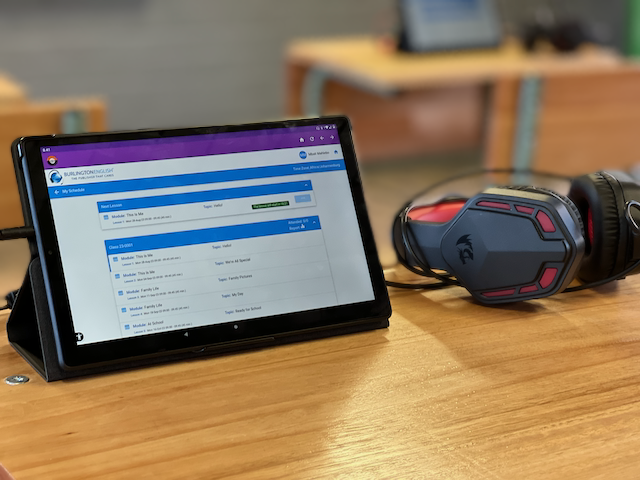Tablet and headphones showing English Literacy Programme